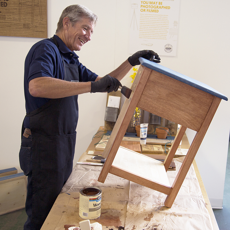 Bruce Johnson applying Vermont Maple wood stain