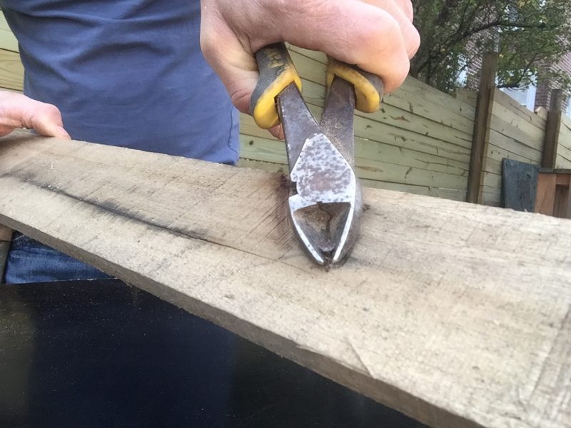 Removing a nail with pliers