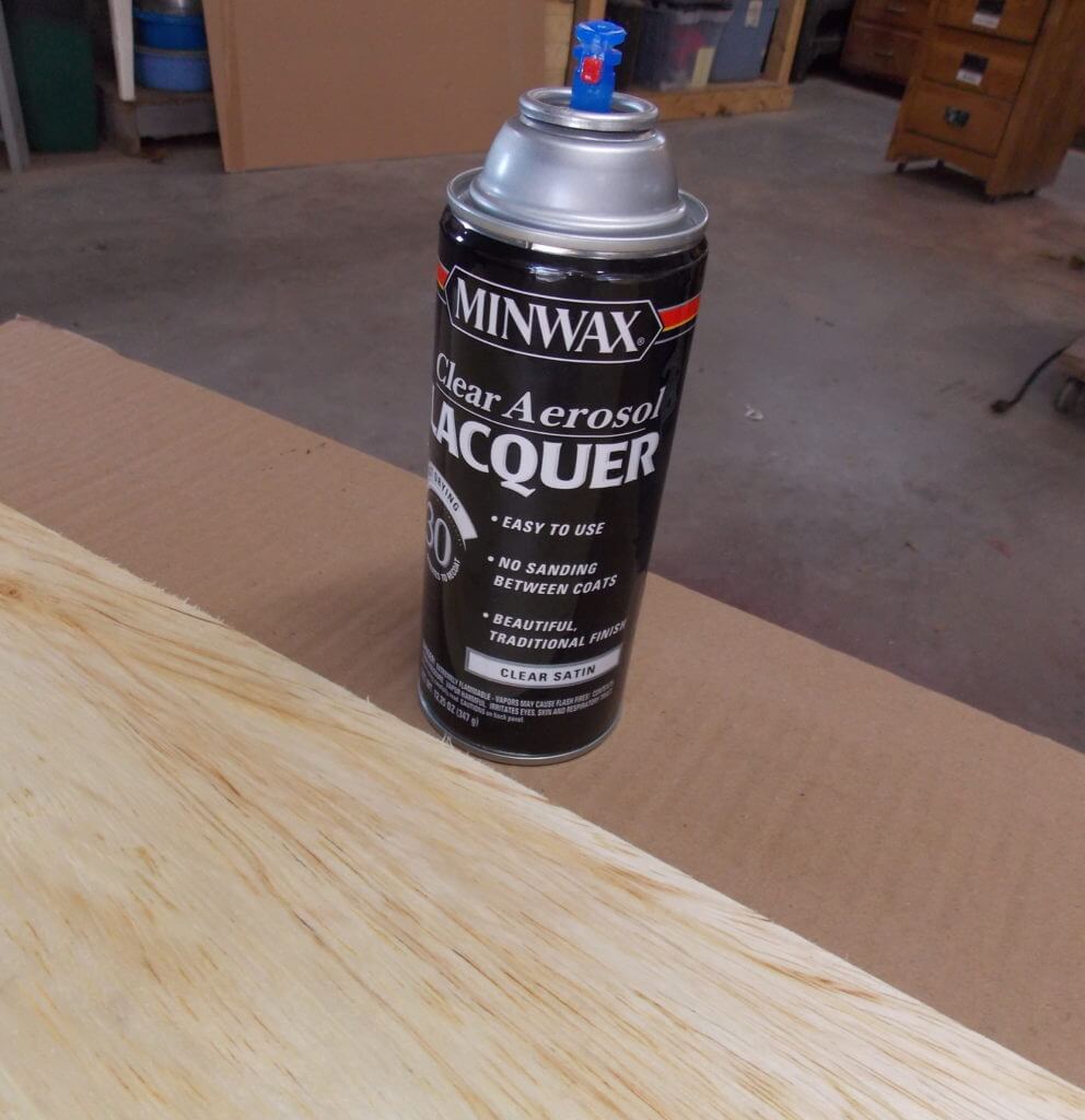 Piece of cut birch plywood sealed with Minwax Clear Aerosol Lacquer