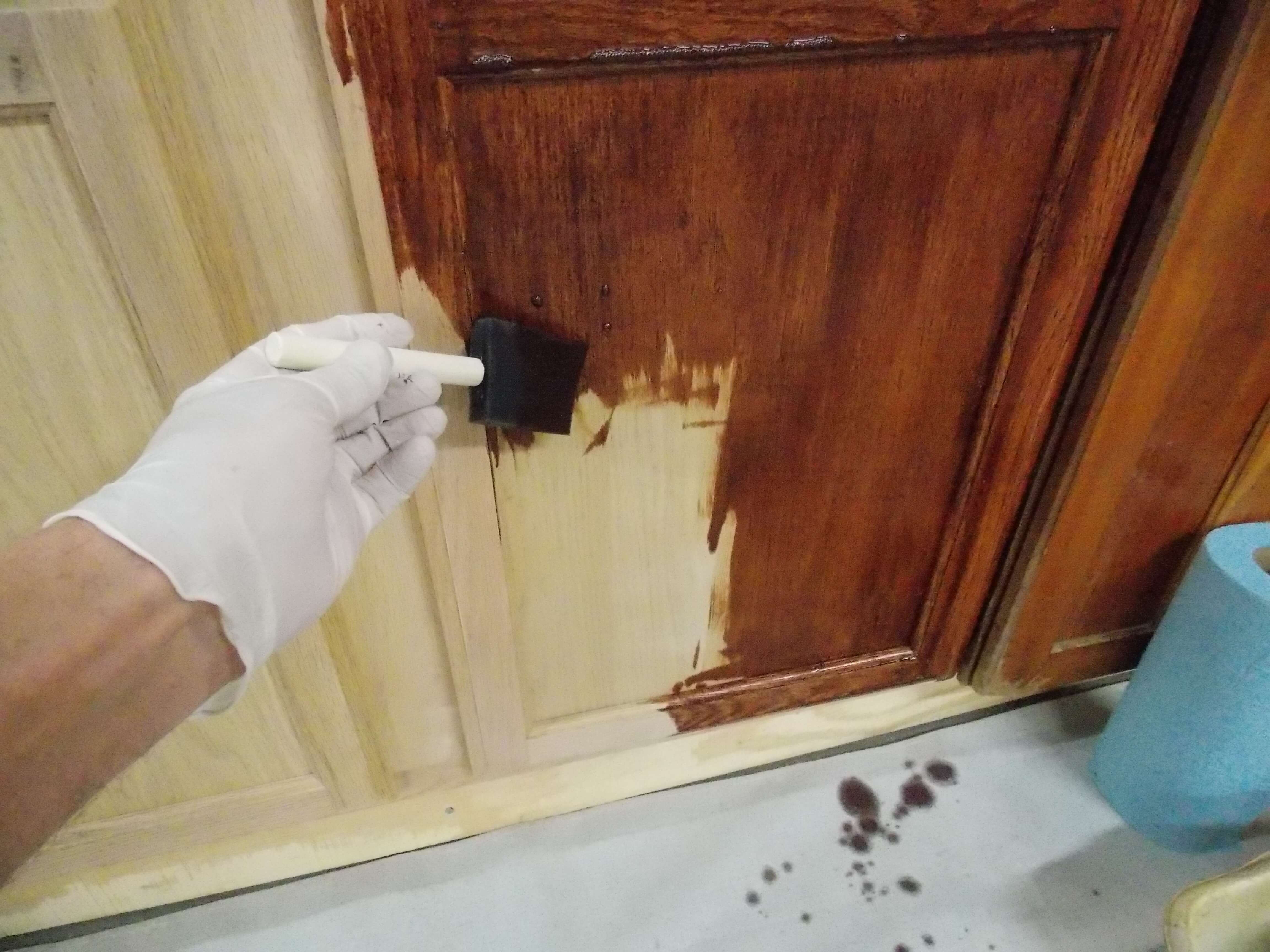 Using foam brush to apply cabinet stain