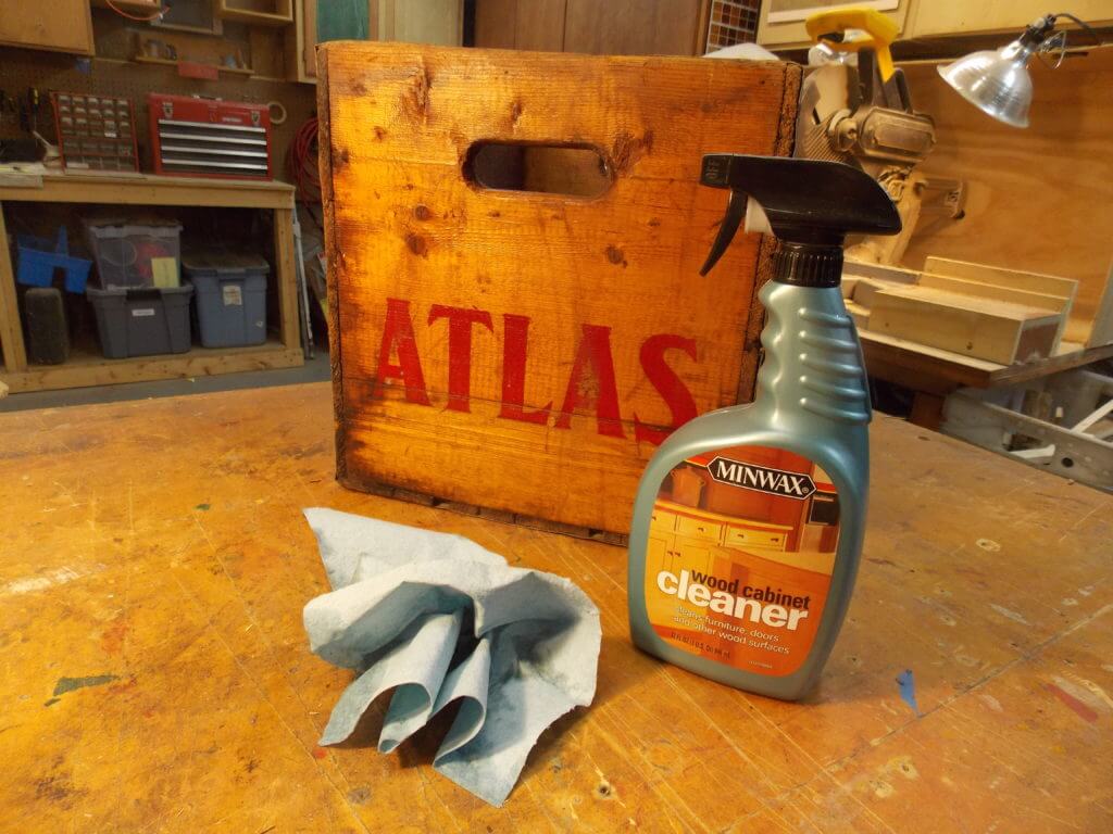 Using Minwax wood cabinet cleaner spray to clean old vintage crate