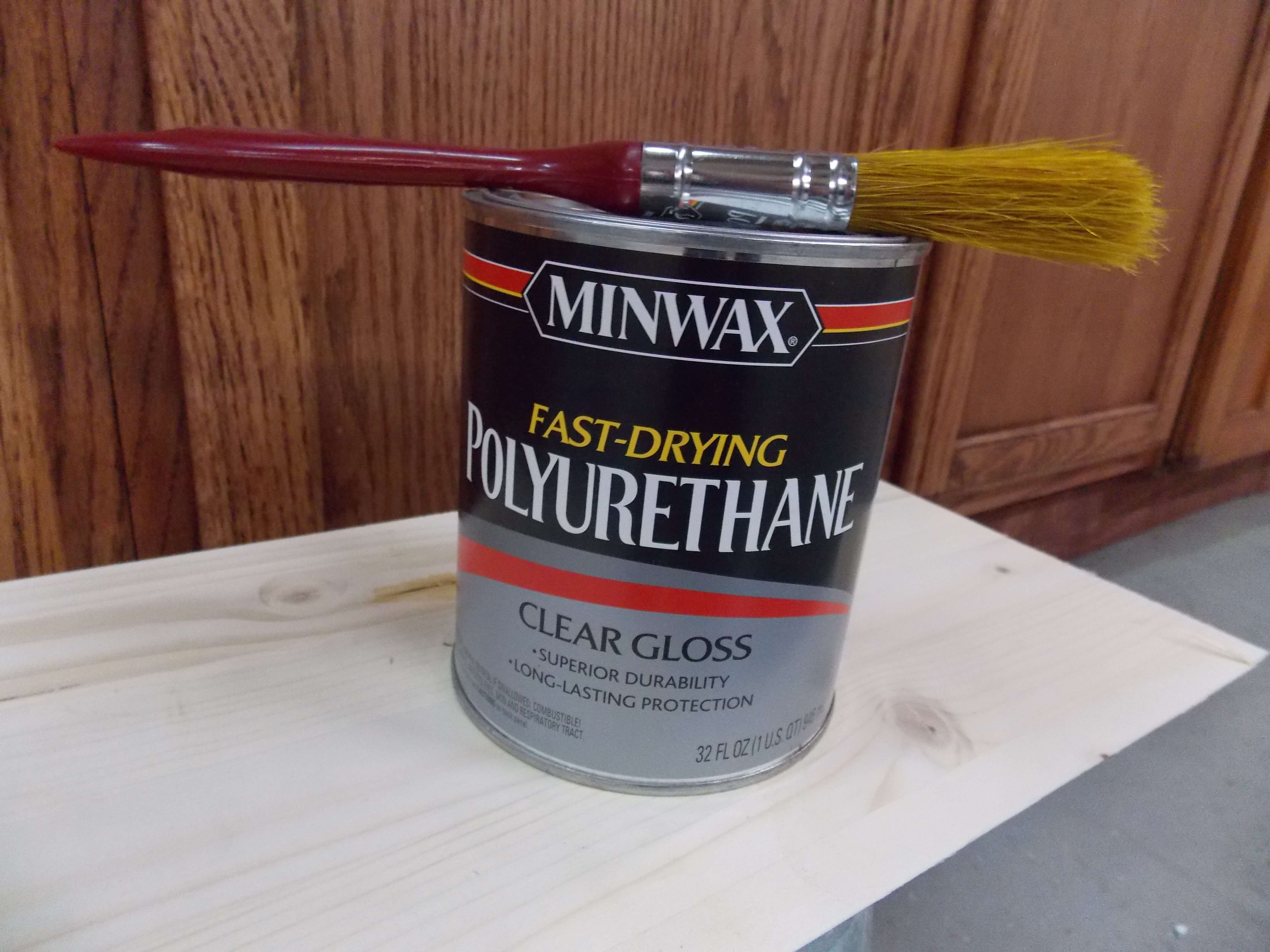 Apply a coat of fast-drying polyurethane to seal in cabinet stain