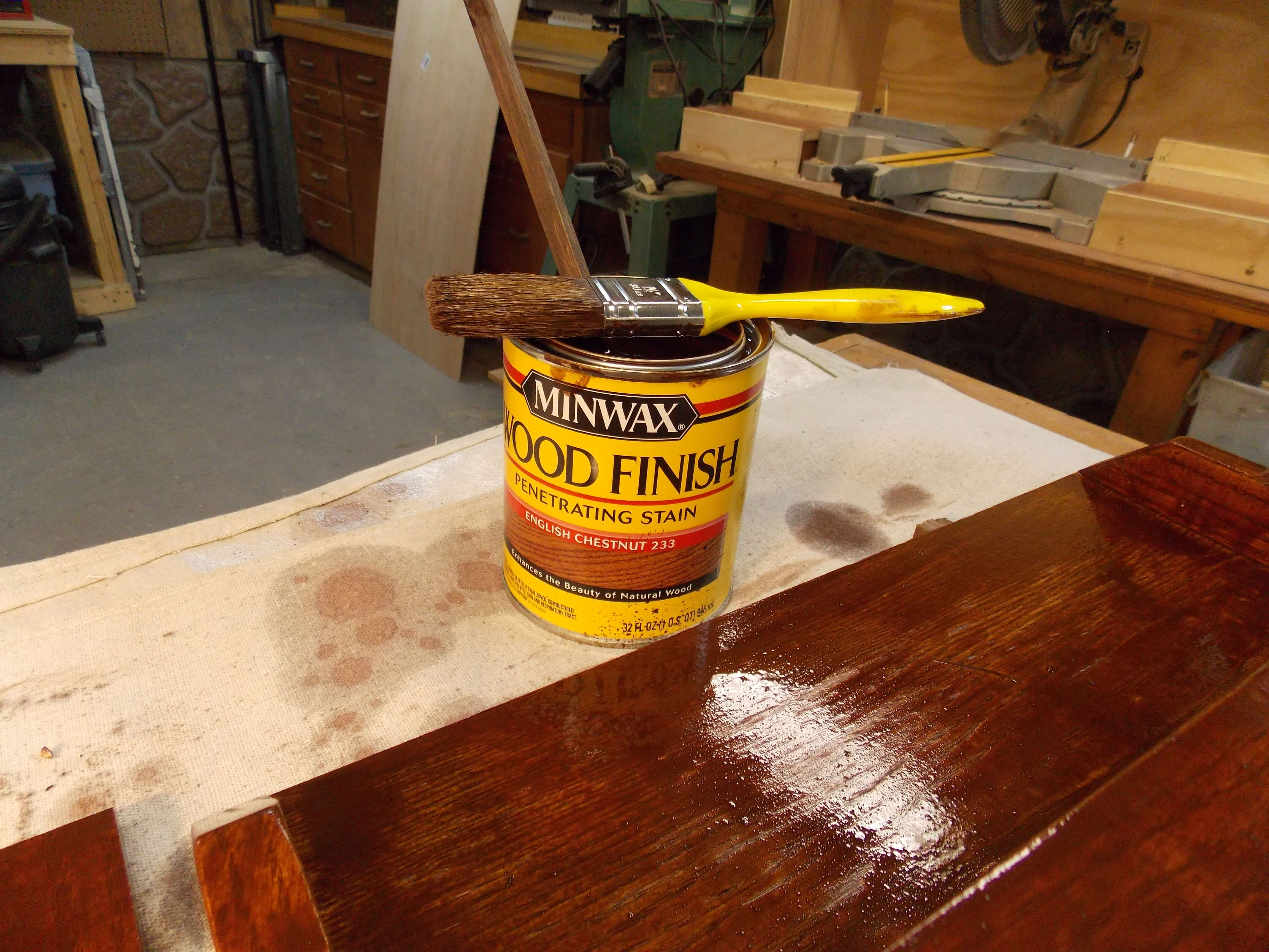 Brush on a coat of Minwax English Chestnut stain to achieve an Arts and Crafts look
